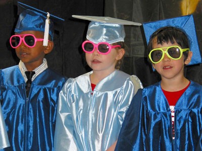 Preschool graduation cap and gown and shades