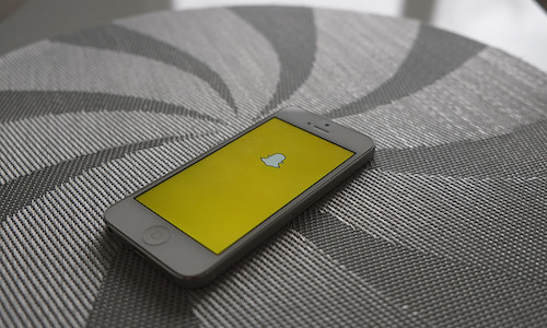 Snapchat's parent company is gearing up for a Wall Street debut that could be the nation's largest technology IPO since 2014. (Image "Snapchat" by AdamPrzezdziek via Flickr, CC BY 2.0.)
