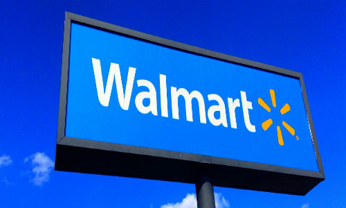 "Wal-Mart lured more shoppers during the quarter, but profits fell as the retailer invested heavily to compete with Amazon." ("Wal-Mart" Photo courtesy of Flickr user Mike Mozart).