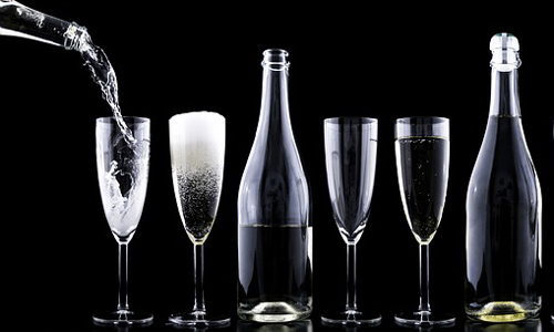 Chances are, readers will be celebrating the coming New Year with a glass of champagne. (Photo via Pixabay)
