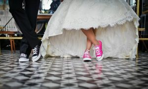 Bride and groom wearing Converse sneakers