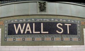 The footnotes in public companies' SEC filings are full of great leads for business journalists. (Wall Street Subway Station image by Michael Daddino via Flickr, CC BY 2.0)