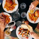 Overhead view of four plates of food