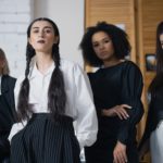 Four women in business attire