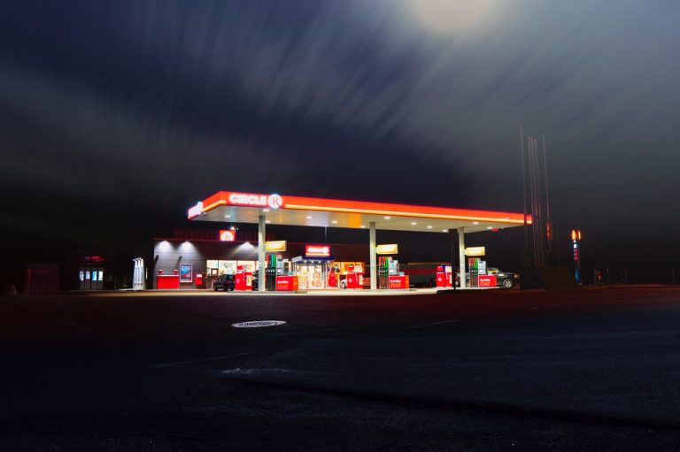 Gas station lit up at night time
