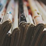 A collection of trade journals with worn spines