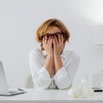 Frustrated women covering face