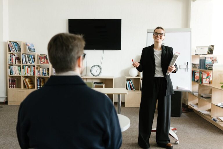 Woman in business formal speaking to colleague