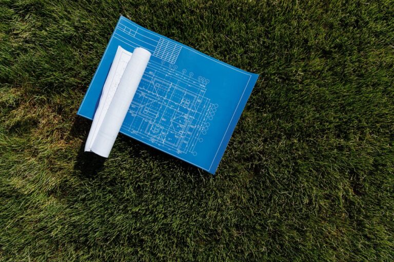 Blueprint on a Grassy Ground