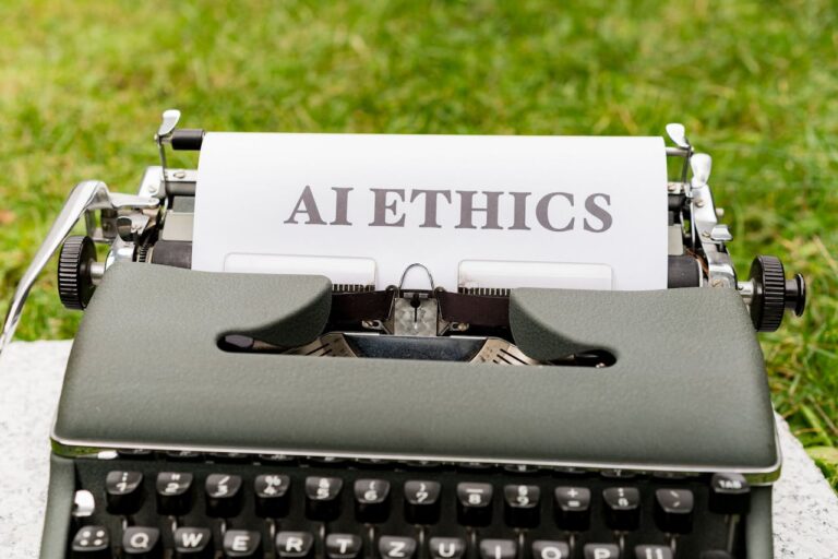 A typewriter with the words "ai ethics" typed on paper