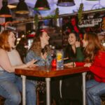 Group of Women Socializing in a Vibrant Cafe
