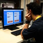 Student looking at subscription options on a computer