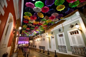 building alleyway covered in umbrellas