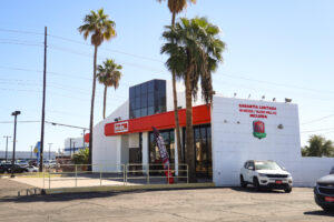 Tricolor building with empty parking lot