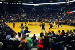 Court side view of women's basketball game play