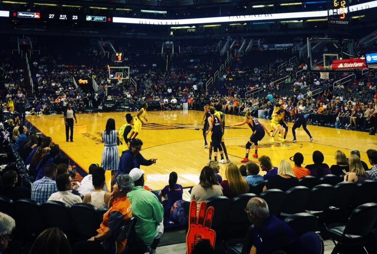 Court side view of women's basketball game play