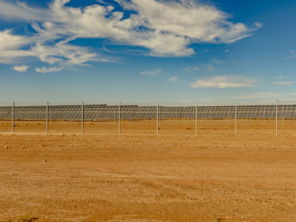 Field of solar panels in sandy area