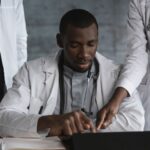Doctors in discussion over a medical research project in a clinical setting.